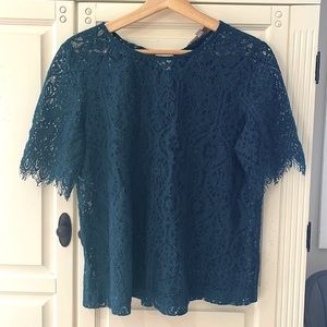LOFT blue lace top with bow detailing on the back.